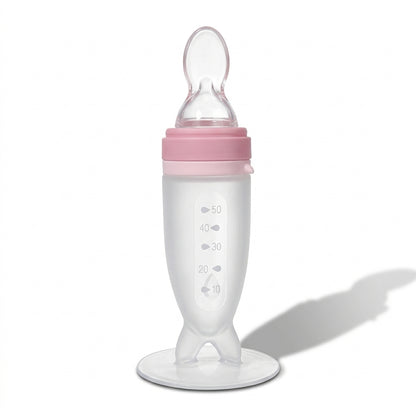 Nomly squeeze spoon feeder in Pink
